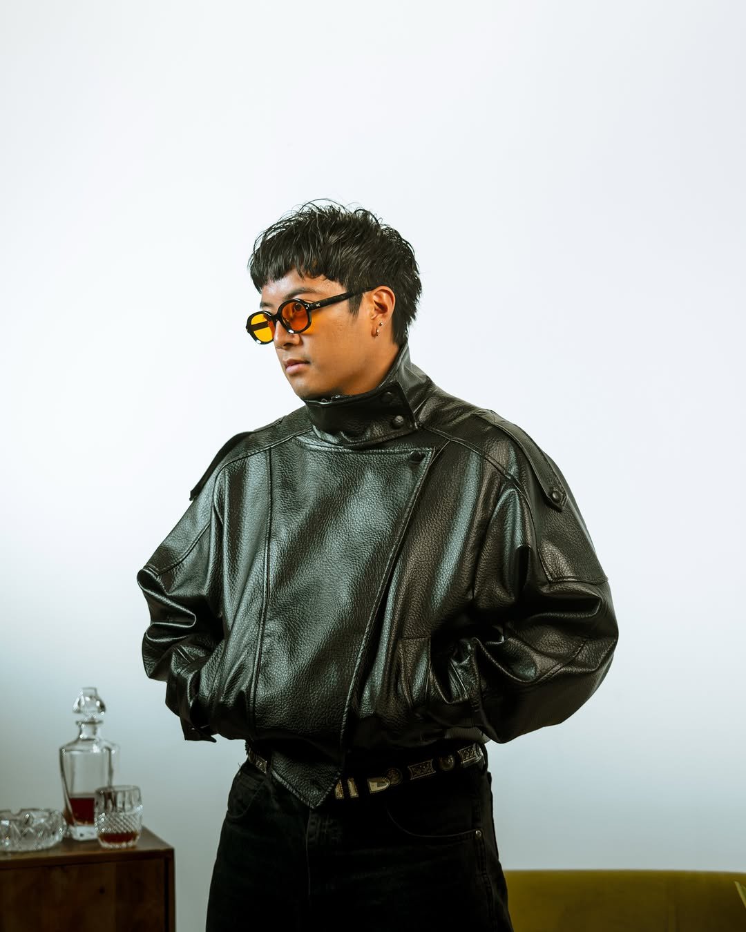 Black leather jacket and orange-tinted glasses — photo by ckcvts